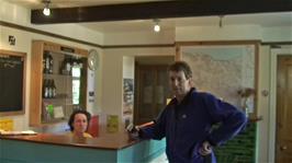 Michael at the Minehead Youth Hostel reception, caught by Ash while doing his video tour of the hostel